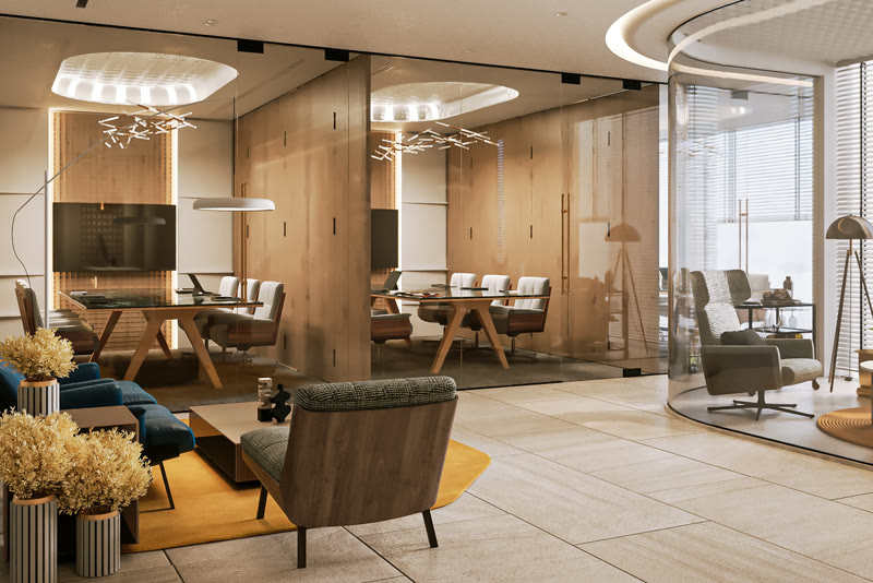 Modern office lobby with glass-walled conference rooms and a lounge area